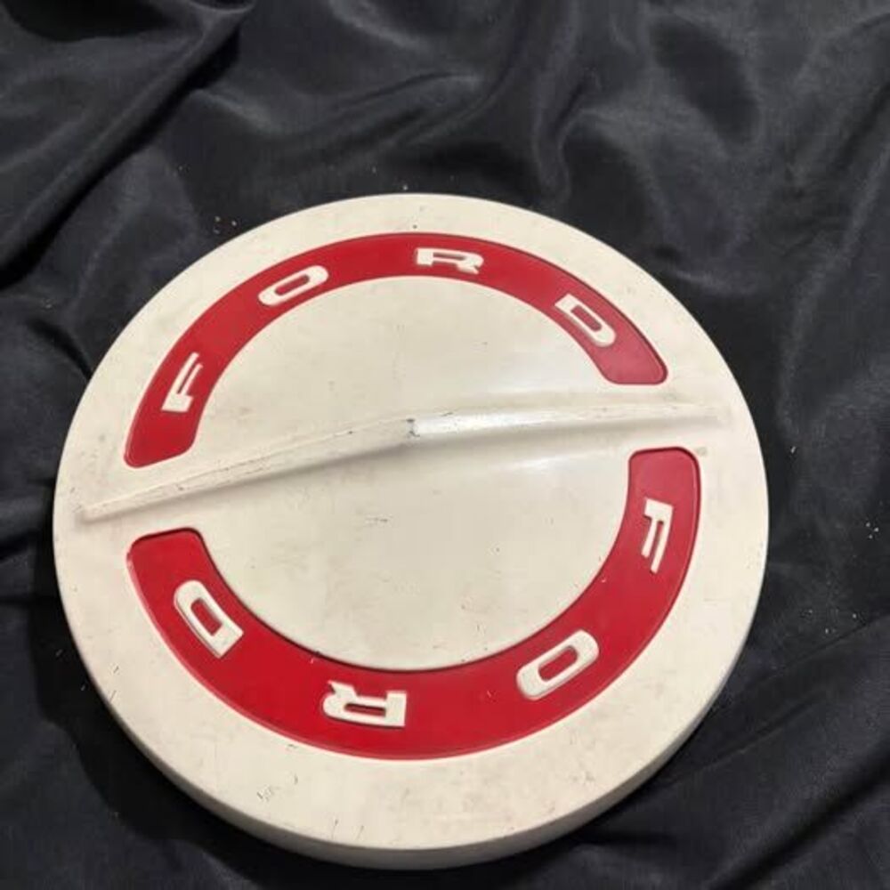 vintage Ford truck hubcap, commonly referred to as a "dog dish" cap
